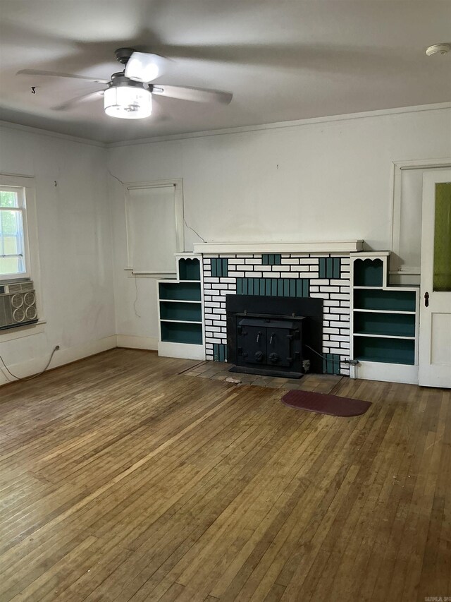 206 W High St, Sheridan, AR 72150 - unfurnished living room with hardwood / wood-style flooring, a tile fireplace, a ceiling fan, crown molding, and cooling unit