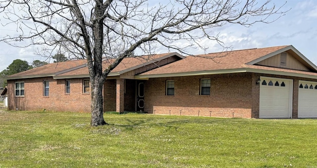 164 Polk Road 714, Mena, AR 71953 - exterior space with brick siding, a shingled roof, an attached garage, and a front lawn