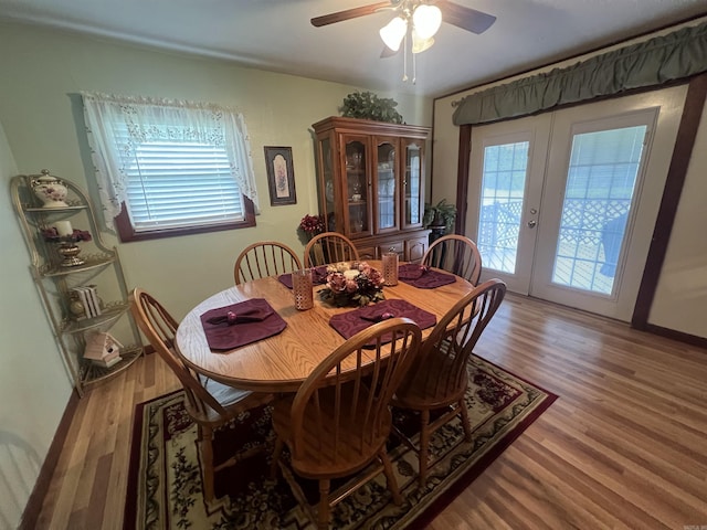 164 Polk Road 714, Mena, AR 71953 - dining area with wood finished floors, french doors, and a ceiling fan