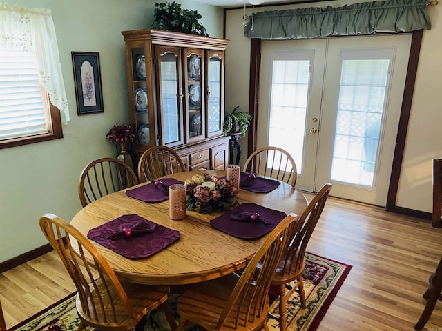 164 Polk Road 714, Mena, AR 71953 - dining space featuring baseboards, light wood-style floors, and french doors