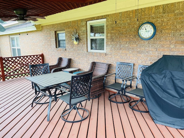 164 Polk Road 714, Mena, AR 71953 - wooden terrace with outdoor dining area and ceiling fan