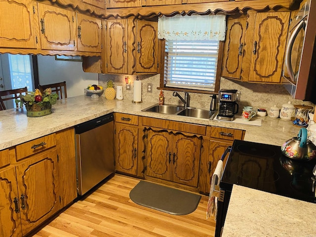 164 Polk Rd Unit 714, Mena, AR 71953 - kitchen with a sink, backsplash, brown cabinets, and appliances with stainless steel finishes