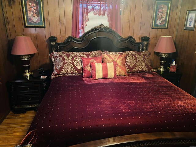 164 Polk Rd Unit 714, Mena, AR 71953 - bedroom with wood finished floors and wood walls