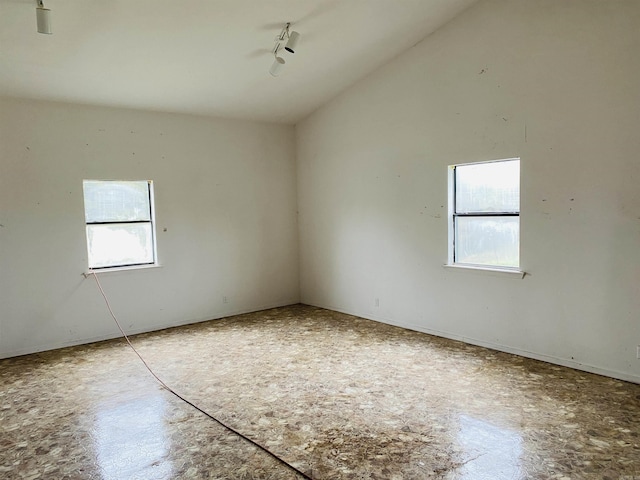164 Polk Rd Unit 714, Mena, AR 71953 - spare room featuring track lighting and vaulted ceiling