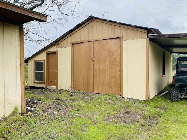 164 Polk Rd Unit 714, Mena, AR 71953 - view of outbuilding with an outdoor structure and a carport