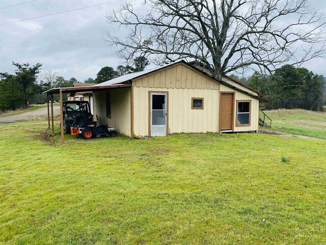 164 Polk Rd Unit 714, Mena, AR 71953 - view of outdoor structure featuring a carport