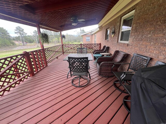164 Polk Rd Unit 714, Mena, AR 71953 - wooden deck with an outdoor hangout area, a grill, and ceiling fan
