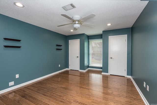 8224 Alvin Ct, Little Rock, AR 72227 - unfurnished room with wood finished floors, a textured ceiling, ceiling fan, baseboards, and recessed lighting