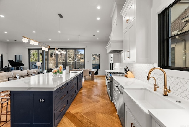 5204 Stonewall Rd, Little Rock, AR 72207 - kitchen featuring custom range hood, white cabinets, a sink, and high end stainless steel range