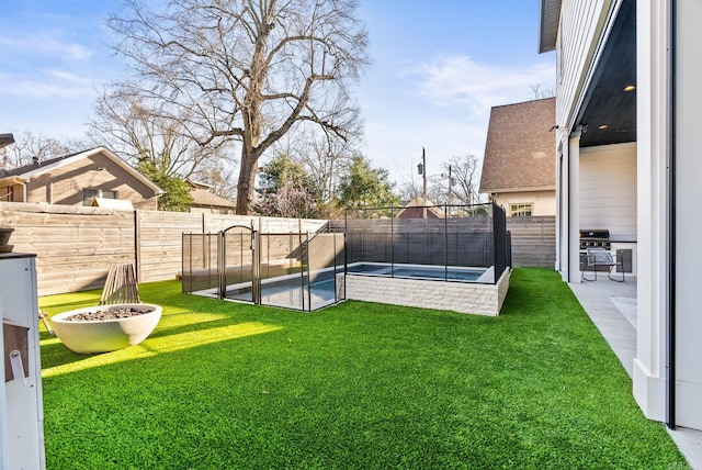 5204 Stonewall Rd, Little Rock, AR 72207 - view of yard featuring a fenced backyard and a fenced in pool
