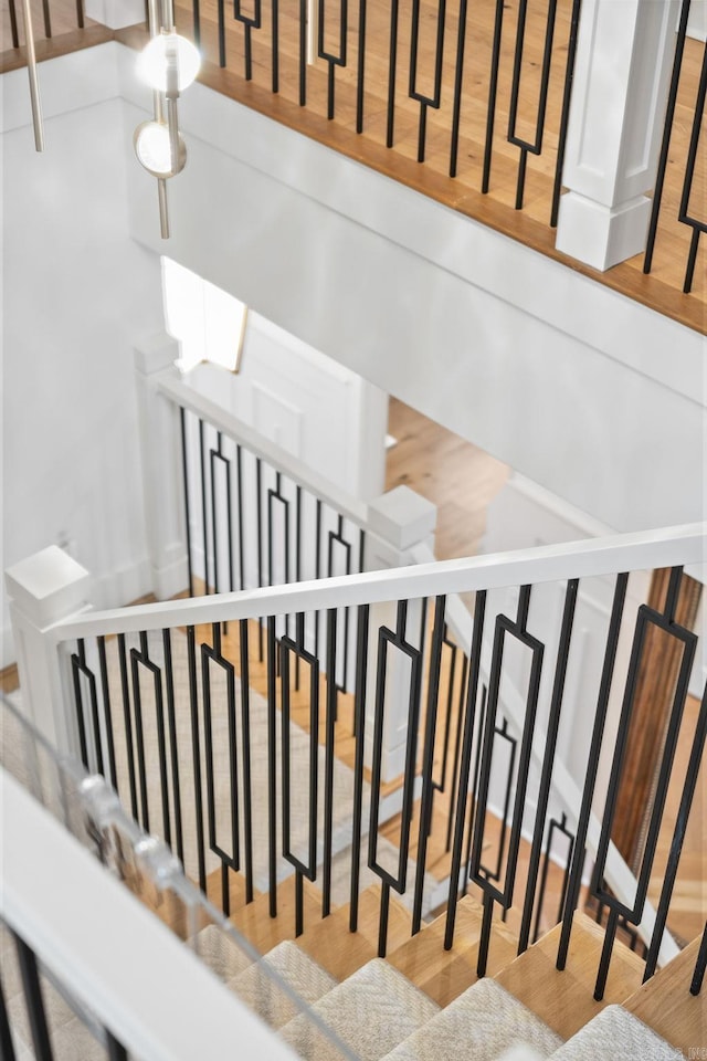 5204 Stonewall Rd, Little Rock, AR 72207 - stairway featuring wood finished floors
