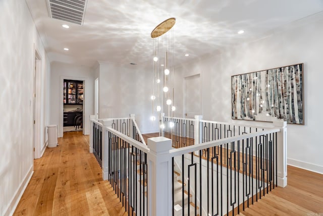 5204 Stonewall Rd, Little Rock, AR 72207 - corridor with baseboards, visible vents, an upstairs landing, and hardwood / wood-style floors