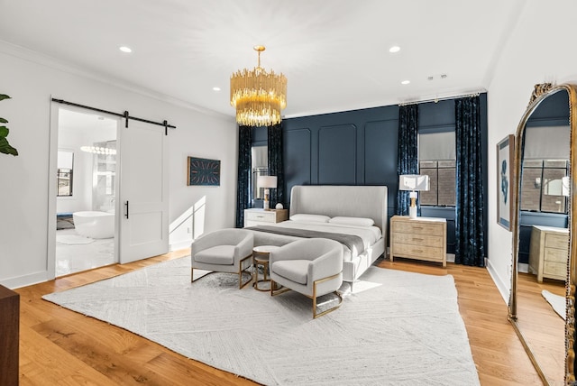 5204 Stonewall Rd, Little Rock, AR 72207 - bedroom featuring crown molding, a barn door, light wood-style flooring, recessed lighting, and an inviting chandelier