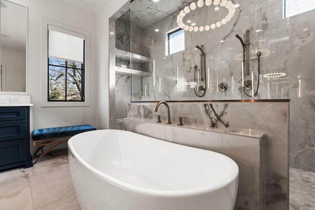5204 Stonewall Rd, Little Rock, AR 72207 - full bathroom with vanity, a marble finish shower, ornamental molding, marble finish floor, and a freestanding bath