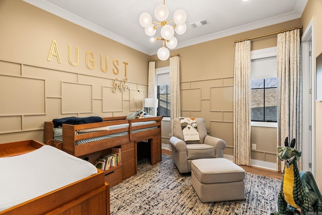 5204 Stonewall Rd, Little Rock, AR 72207 - bedroom with a notable chandelier, wood finished floors, a decorative wall, visible vents, and ornamental molding