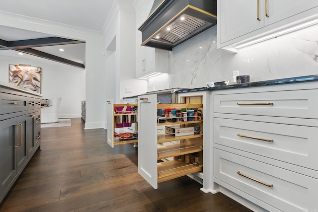 125 Hallen Ln, Little Rock, AR 72223 - kitchen featuring ornamental molding, dark wood-type flooring, baseboards, decorative backsplash, and custom exhaust hood