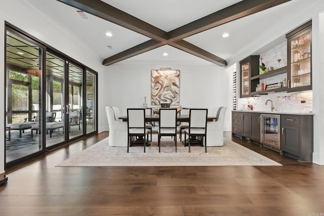 125 Hallen Ln, Little Rock, AR 72223 - dining space featuring dark wood finished floors, beverage cooler, beamed ceiling, visible vents, and indoor wet bar