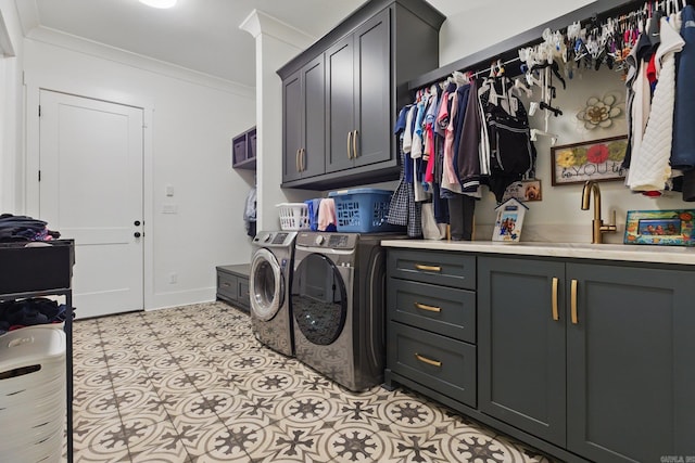 125 Hallen Ln, Little Rock, AR 72223 - laundry room featuring washer and clothes dryer, ornamental molding, baseboards, a sink, and cabinet space