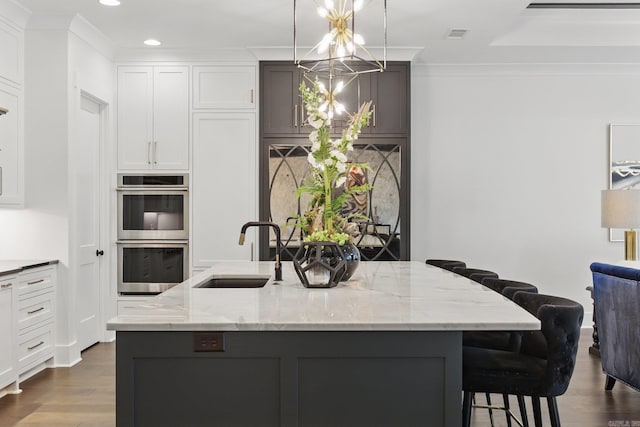 125 Hallen Ln, Little Rock, AR 72223 - kitchen with a chandelier, crown molding, stainless steel double oven, dark wood-type flooring, and a sink