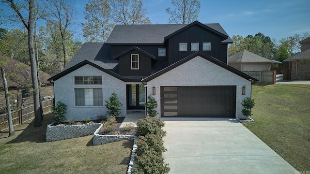9 Marchwood Cv, Little Rock, AR 72210 - view of front of property featuring fence, board and batten siding, concrete driveway, and a front yard
