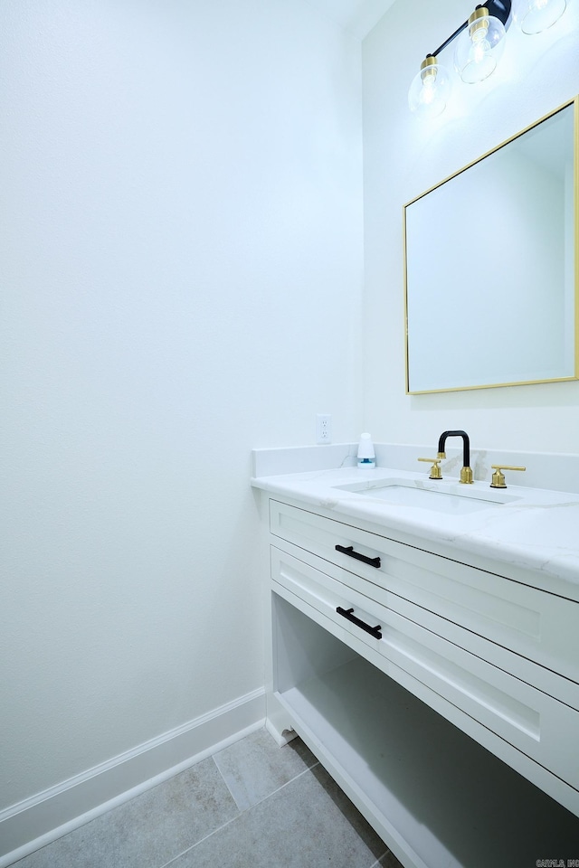 9 Marchwood Cv, Little Rock, AR 72210 - bathroom featuring tile patterned floors, vanity, and baseboards