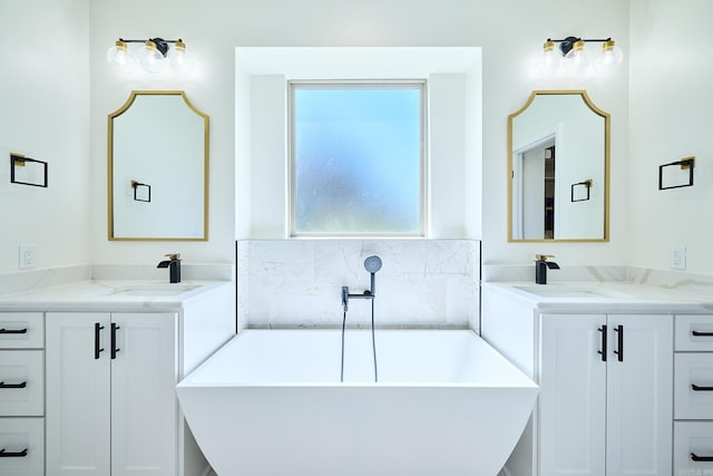 9 Marchwood Cv, Little Rock, AR 72210 - full bathroom with a freestanding tub, a sink, and two vanities