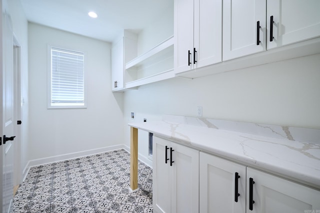 9 Marchwood Cv, Little Rock, AR 72210 - laundry room with washer hookup, electric dryer hookup, baseboards, cabinet space, and recessed lighting