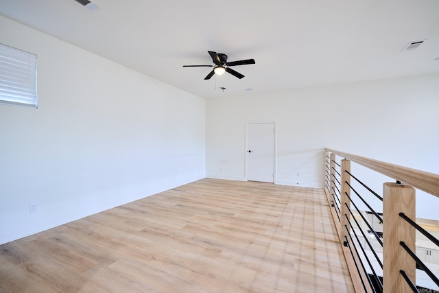 9 Marchwood Cv, Little Rock, AR 72210 - empty room featuring light wood-type flooring, visible vents, and a ceiling fan