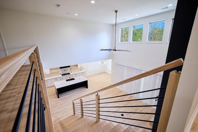 9 Marchwood Cv, Little Rock, AR 72210 - stairway featuring visible vents, wood finished floors, and recessed lighting
