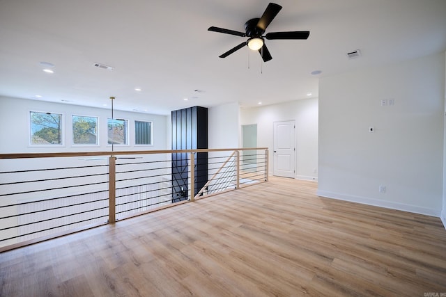 9 Marchwood Cv, Little Rock, AR 72210 - empty room with baseboards, visible vents, light wood-style flooring, and a ceiling fan