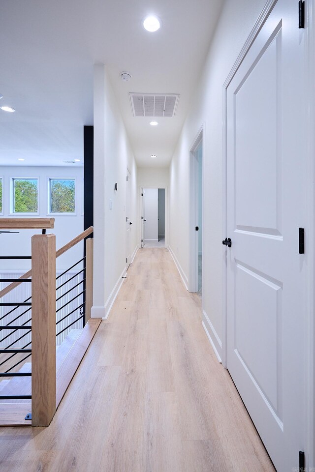 9 Marchwood Cv, Little Rock, AR 72210 - hallway featuring an upstairs landing, light wood-style flooring, baseboards, visible vents, and recessed lighting
