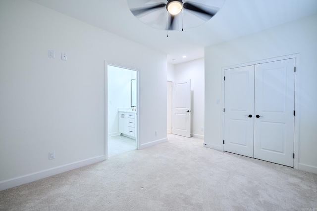 9 Marchwood Cv, Little Rock, AR 72210 - unfurnished bedroom featuring baseboards, ensuite bath, a ceiling fan, light carpet, and a closet