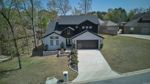 9 Marchwood Cv, Little Rock, AR 72210 - view of front of property featuring fence, driveway, a front yard, and a garage