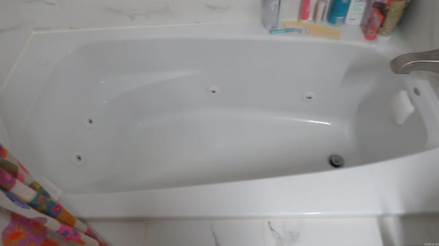 details featuring a tub with jets