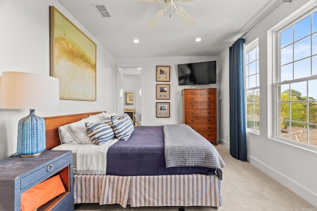 carpeted bedroom with recessed lighting, baseboards, multiple windows, and visible vents