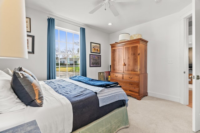 bedroom with light colored carpet, recessed lighting, baseboards, and a ceiling fan