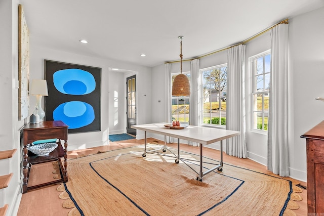 dining area featuring baseboards, recessed lighting, and light wood-style floors