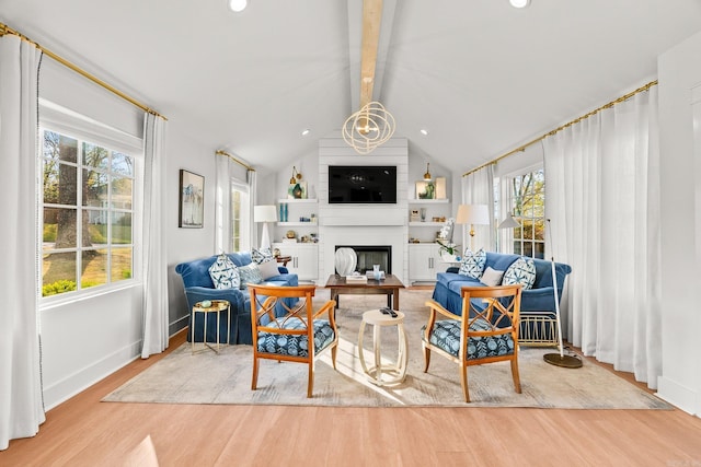 living area with a large fireplace, baseboards, wood finished floors, recessed lighting, and vaulted ceiling with beams