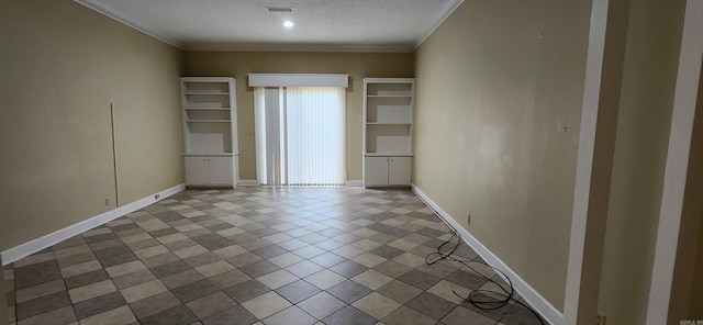unfurnished room featuring baseboards, visible vents, crown molding, and a textured ceiling