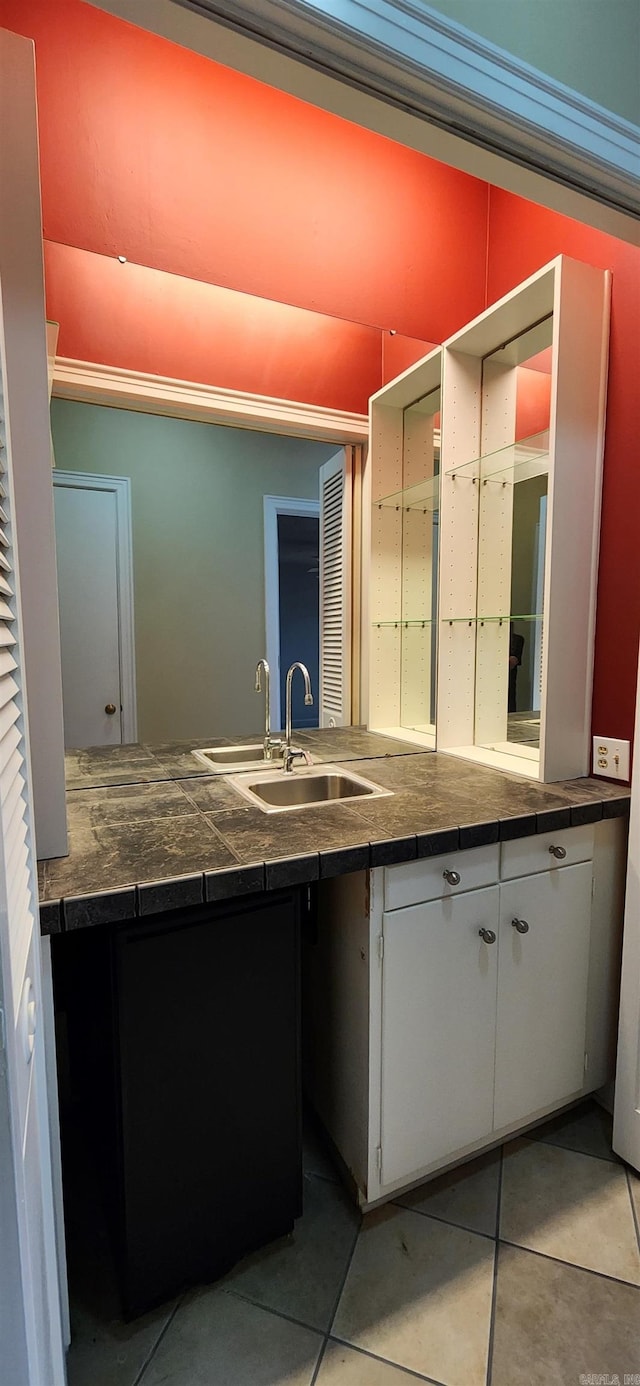 bathroom with tile patterned floors and vanity