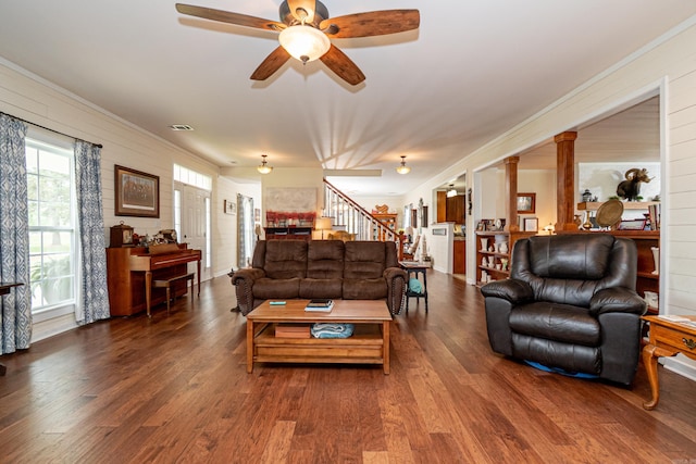 living room with visible vents, wood finished floors, stairway, and a ceiling fan