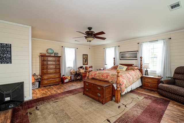 bedroom with multiple windows, light wood-type flooring, and visible vents