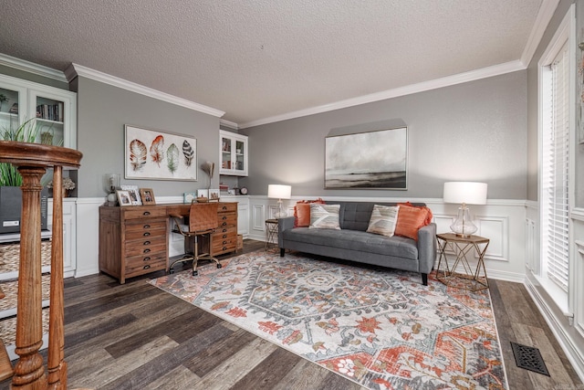 living room with dark wood-style floors, visible vents, and crown molding