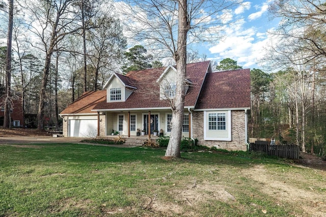 cape cod home with covered porch, a garage, a front lawn, and brick siding