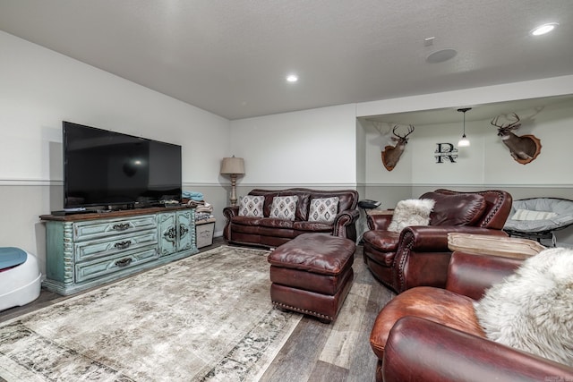 living room featuring recessed lighting and wood finished floors