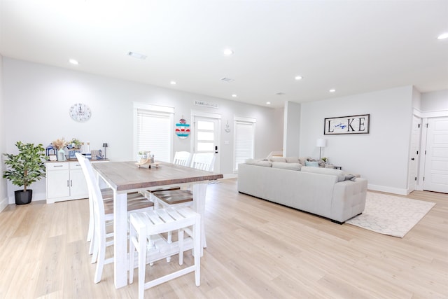dining area with baseboards, visible vents, recessed lighting, and light wood finished floors