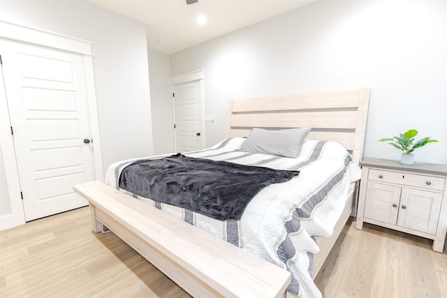 bedroom with recessed lighting and light wood-type flooring