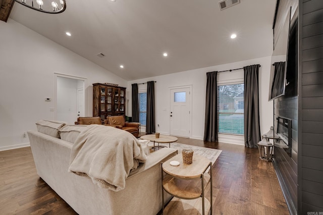 living room with a large fireplace, visible vents, baseboards, recessed lighting, and dark wood finished floors