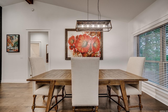 dining room with baseboards, dark wood-style floors, and vaulted ceiling with beams