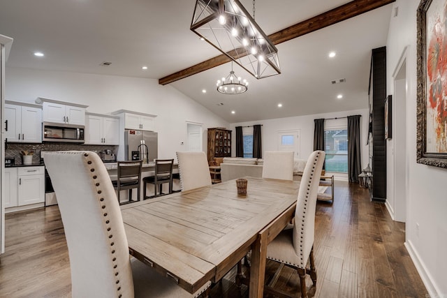 dining area featuring visible vents, beamed ceiling, baseboards, dark wood-style floors, and an inviting chandelier